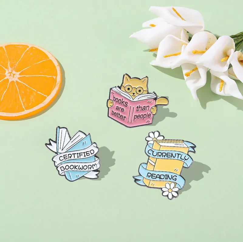 Enamel pins for book lovers.  Choice of designs.