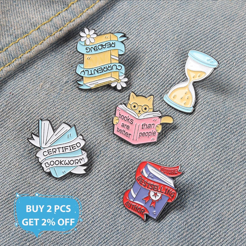 Book Enamel Pins such as, "Bestselling Author," or "Currently Reading."